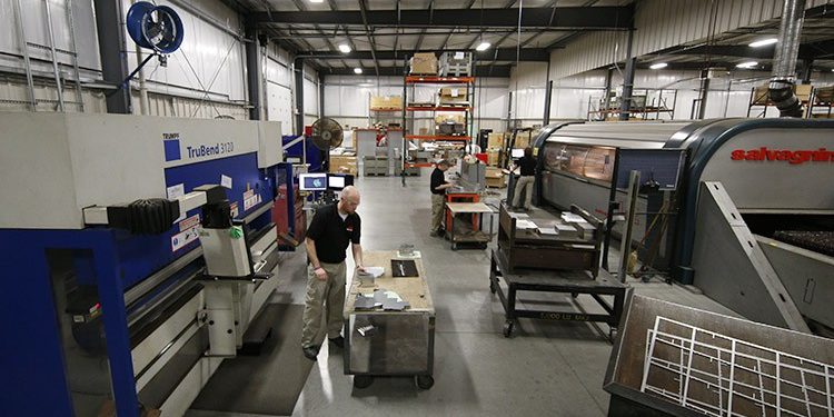 Team of employees working in prototyping shop