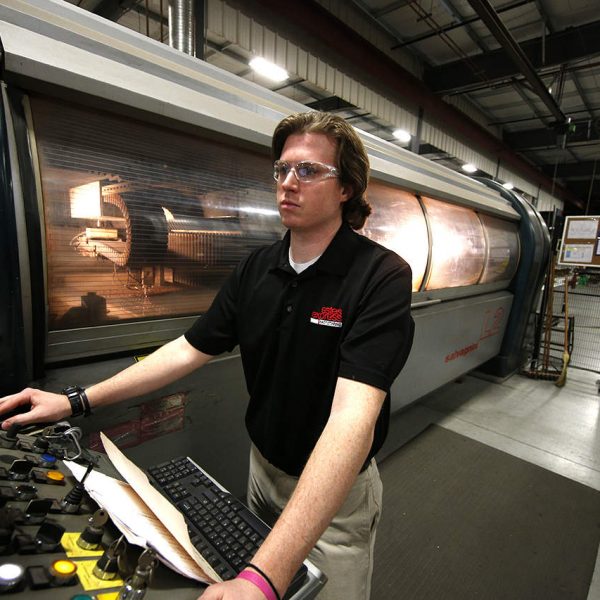 Employee working with laser cutting system